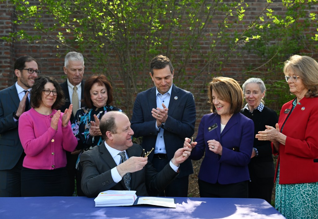 Jared Polis signs Colorado budget with cuts while protecting education