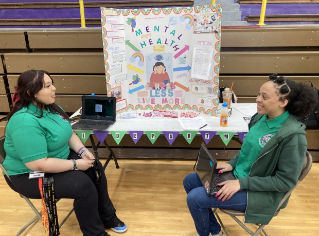 Talking about their Mikva Challenge project are, from left, Ashley Sotelo and Jada Allen. (Steve Sadin/For the Lake County News-Sun)