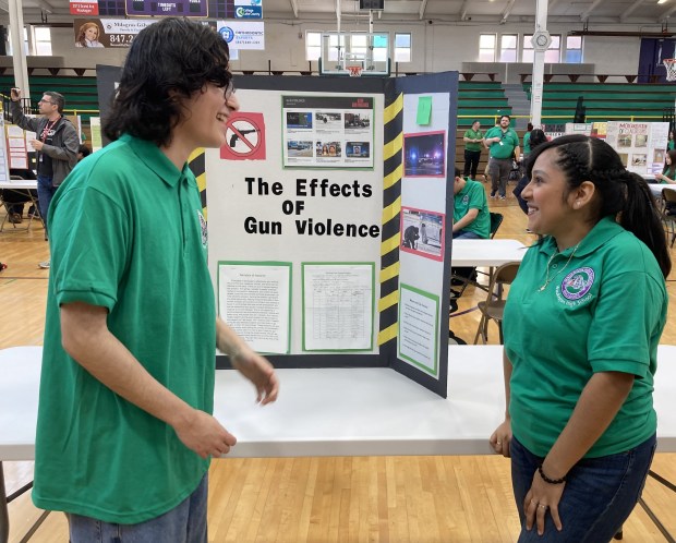 Waukegan High School students Christopher Moreno, left, and Akemi Cruz talk about their Mikva Challenge project. (Steve Sadin/For the Lake County News-Sun)