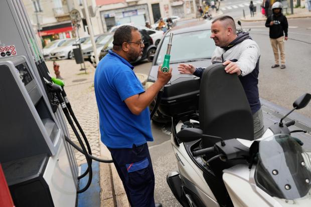 People queue for petrol in Lisbon