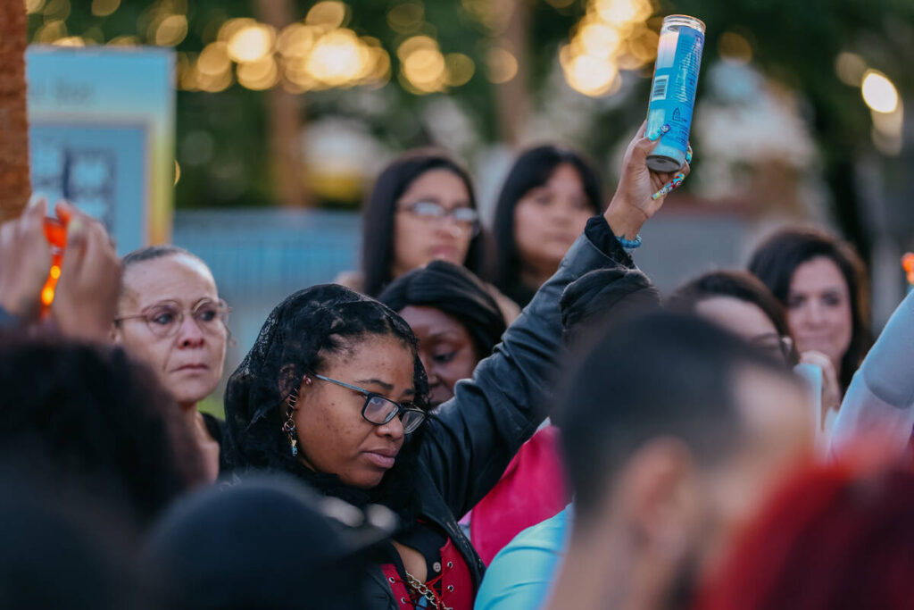 Phalan Whitson holds up a lit candle to commemorate the life of her three-year-old daughter, Jo ...