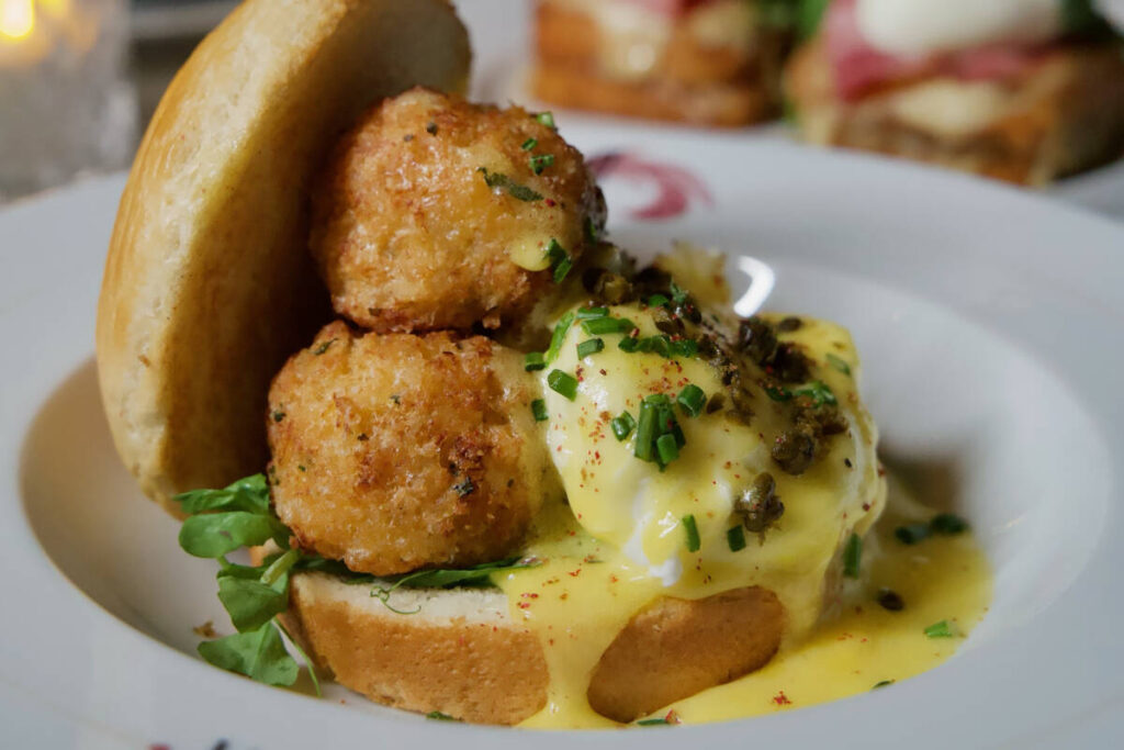 Crab croquette Benedict is being offered for Mother's Day 2025 at Vanderpump à Paris in Pa ...