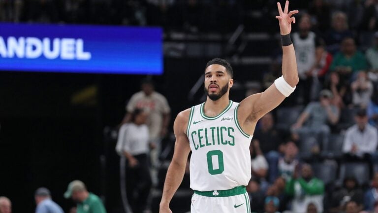 Jayson Tatum of the Celtics gestures during the first half.