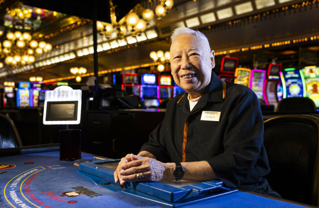 George Lee, 89, poses for a portrait at Four Queens, where he has worked as a blackjack dealer ...