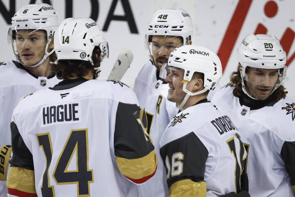 Vegas Golden Knights' Pavel Dorofeyev (16) celebrates his goal with teammates during the first ...