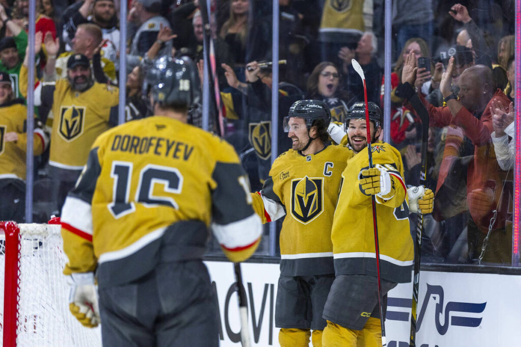 Golden Knights right wing Mark Stone (61) and center Tomas Hertl (48) celebrate his goal agains ...