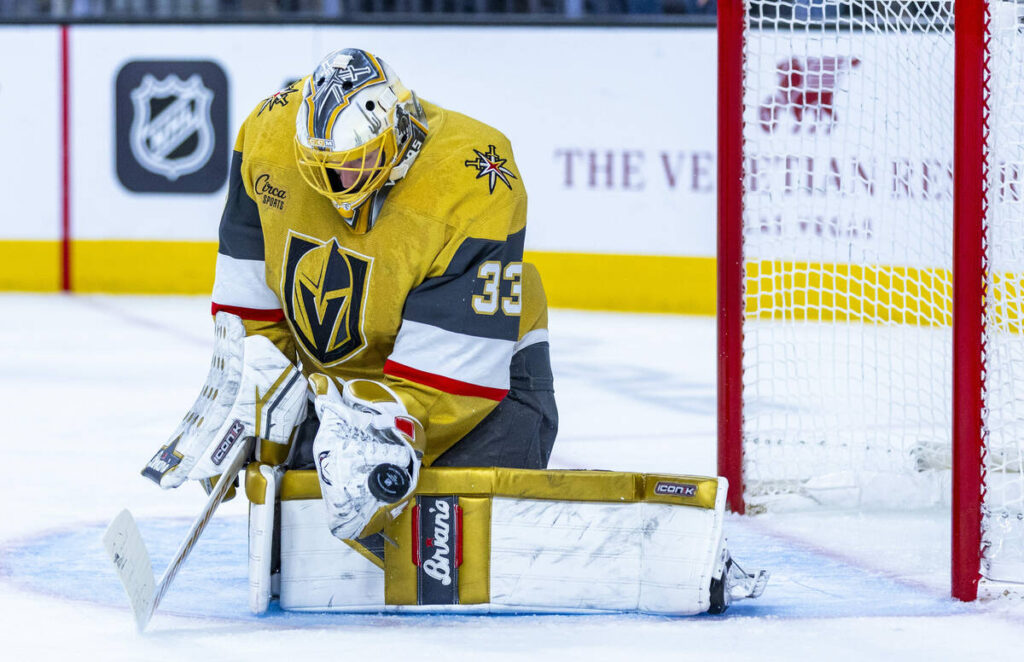 Golden Knights goaltender Adin Hill (33) deflects a shot from the Edmonton Oilers during the se ...