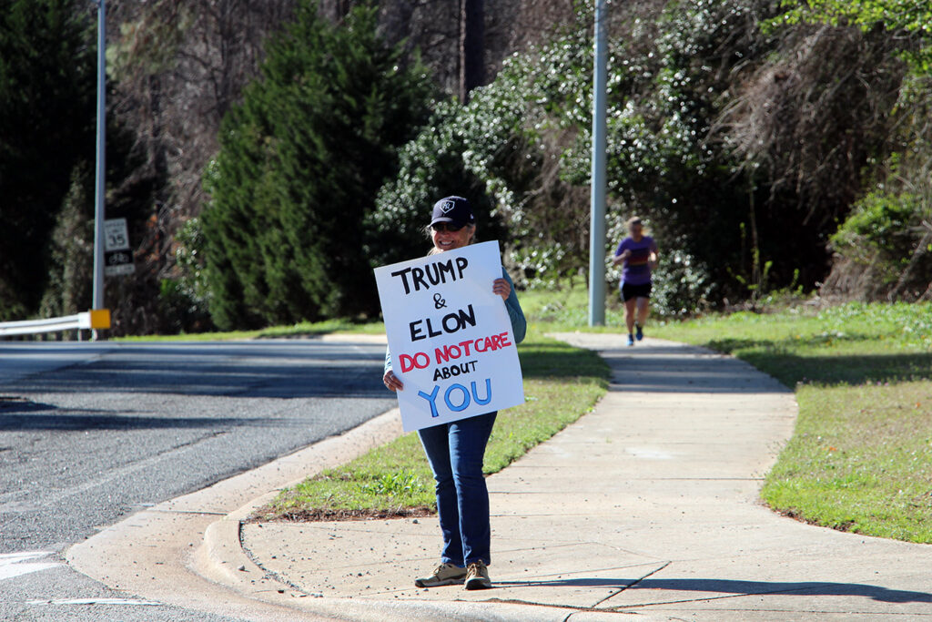 How One Durham Resident Is Finding Community through Solo Roadside Political Protests