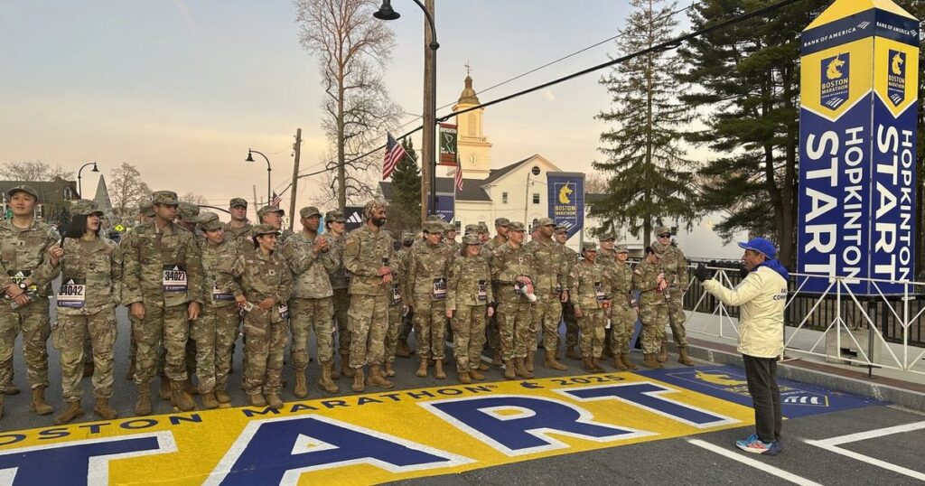 Military marchers set out from Hopkinton to start the 129th Boston Marathon