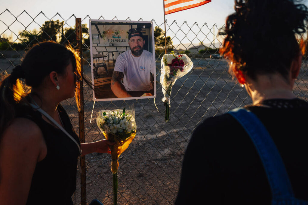 Flowers are left on a fence during a vigil for Jordon Dodder, who died after a crash at the int ...