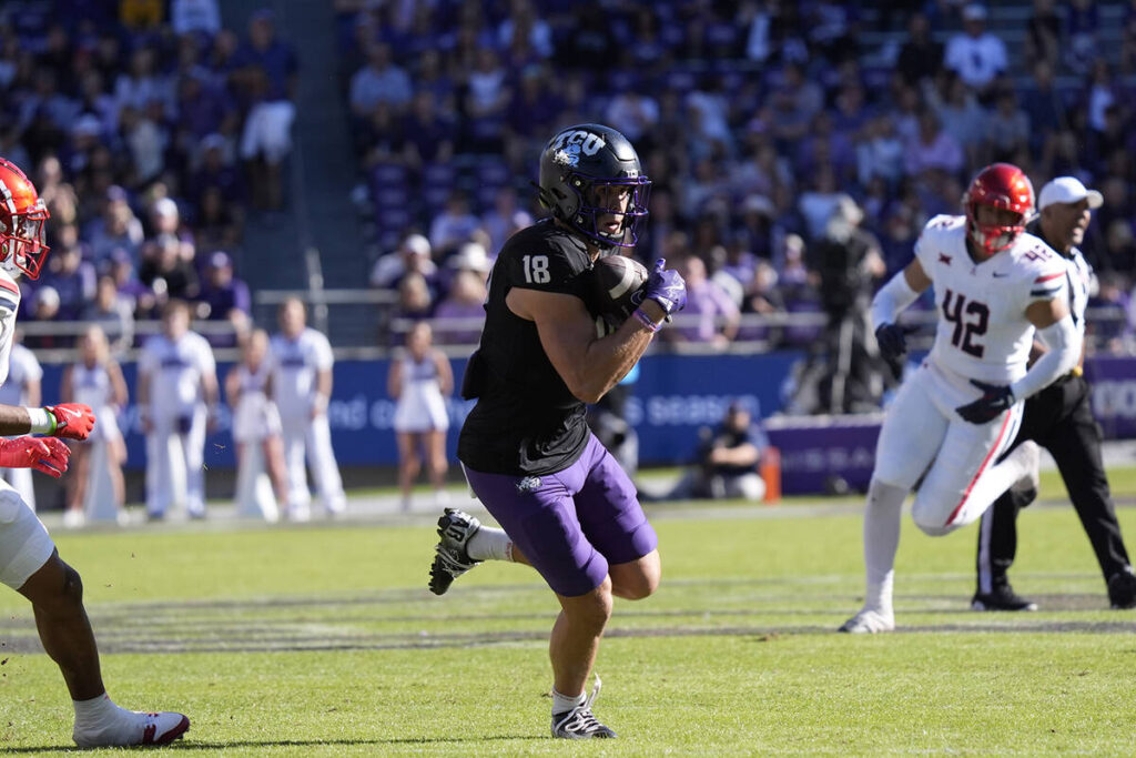 TCU wide receiver Jack Bech (18) pulls in a pass during the first half of an NCAA college footb ...