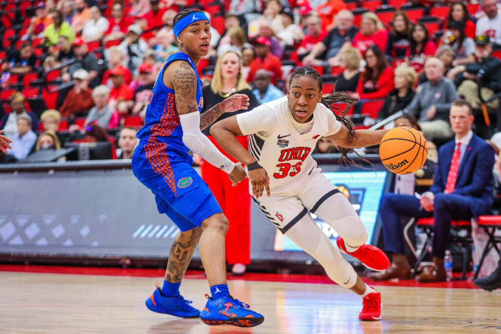 Lady Rebels guard Amarachi Kimpson (33) drives the ball during a second round WIT women’ ...