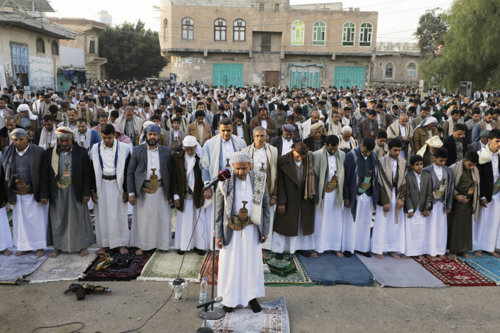 Yemenis pray the mass Eid al-Fitr prayers marking the end of the holy fasting month of Ramadan ...