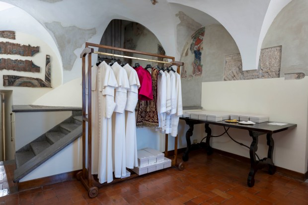 Papal vestments of three different sizes hang in the Room of the Tears