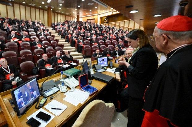 A Vatican employee anulls the papal seal on the pope's seal
