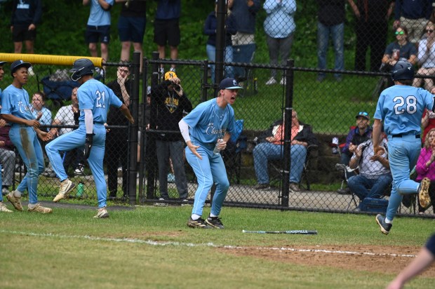 Chesapeake’s Dennis Bailey #21 and Griffin Ochiltree #28 celebrate scoring...