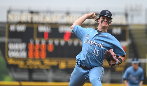 Chesapeake’s Aidan Fleshman delivers a pitch to a Northeast batter...