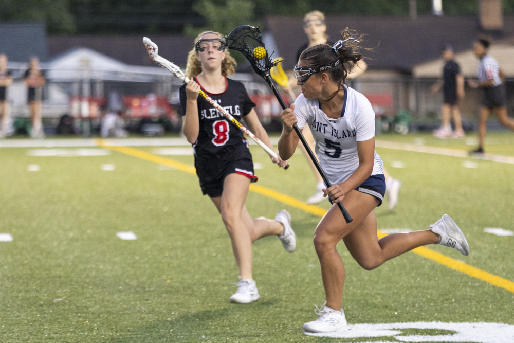 Rita Yost carries the ball downfield during the state semifinal...