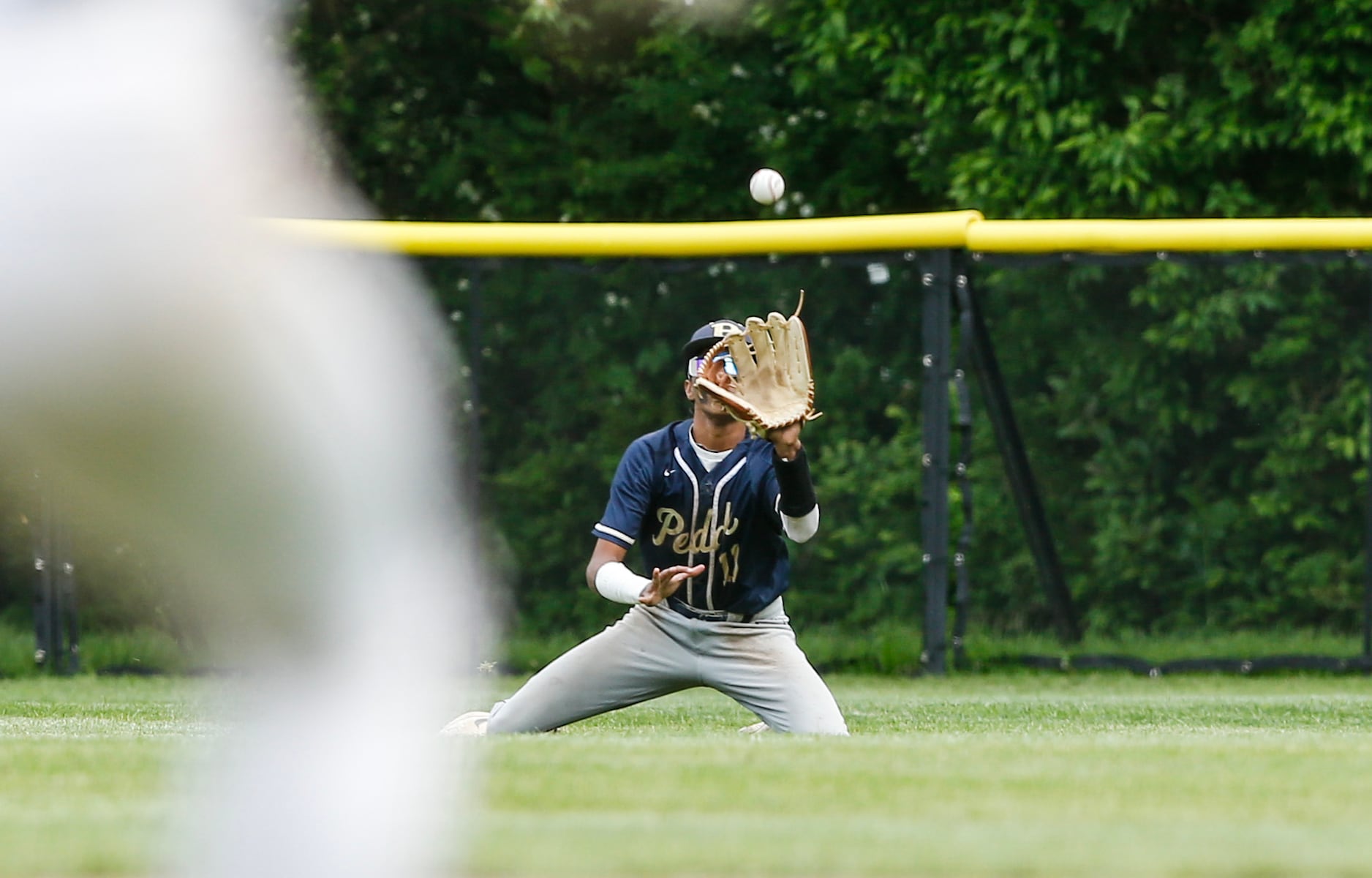 Jaden Heble (11) of Peddie makes a diving catch for an out during the Prep A semifinal baseball game between Hun and Peddie at The Hun School of Princeton in Princeton, NJ on 5/18/25.
