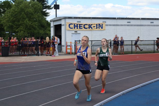 Southern's Rebecca Burgee leads Century's Ella Lustig in the girls Class 2A 800-meter run at the state track and field championships. Burgee won the event, one of three gold medals for her on the day. (Anthony Maluso/Staff)