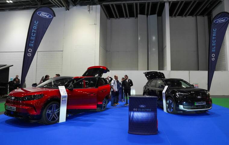 Ford warns Trump tariffs will cost $1.5B, pulls forecast