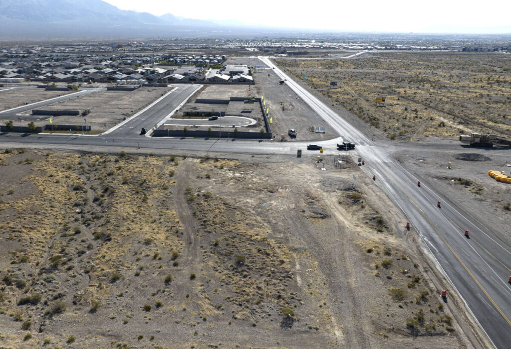 An aerial view of a vacant land that recently sold, front left, located on the north side of Ky ...