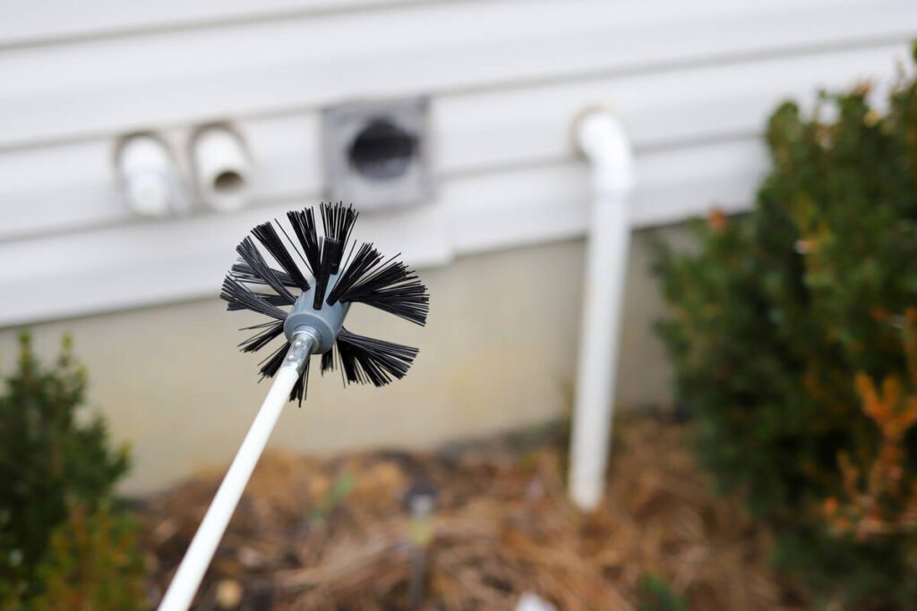 Cleaning the dryer vent requires a round brush on a long flexible snake. (Getty Images)