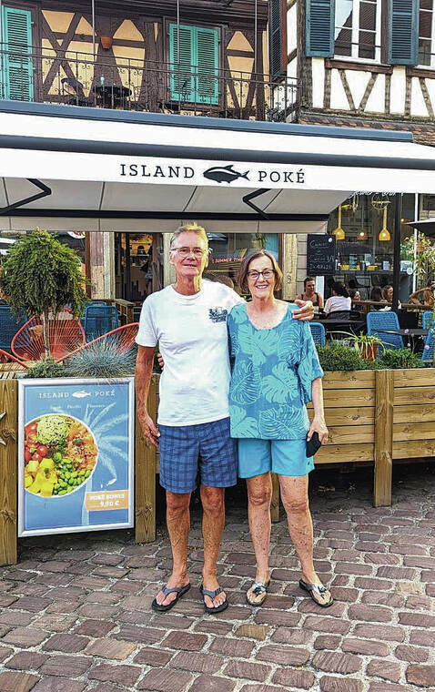 Grant Manning and Maureen St. Michel of Kailua went on a bike trip in Colmar, France, where they came across an Island Poke restaurant. Photo by Sonny Chaisten.