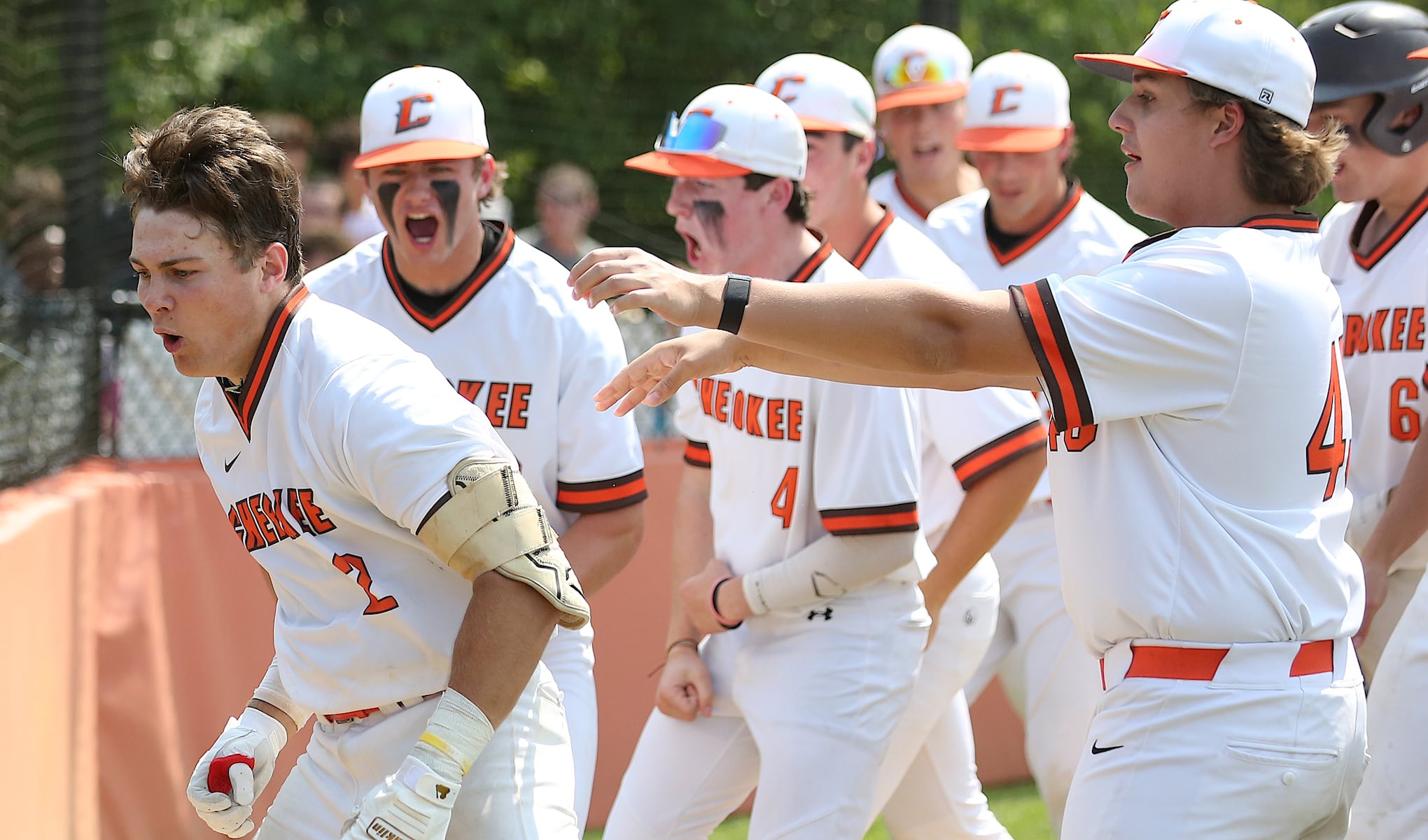 Cherokee teammates celebrate with Jason Brown (2) after he hit a three-run home run in the bottom of the first inning Tuesday against Kingsway.