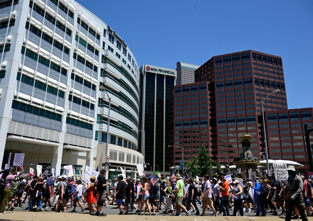 "No Kings" protesters march down West Colfax Avenue near Broadway...
