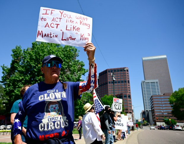 Protester Rick Martinez shows his support at the "No Kings"...
