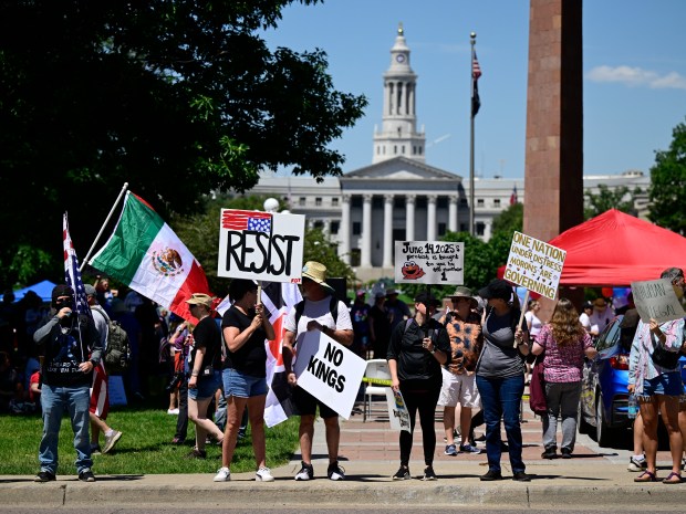Protesters line North Lincoln Street across from the Capitol building...