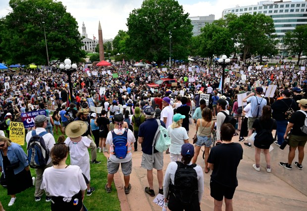 "Ice Out, Stop the Deportations" protesters gather at the Colorado...