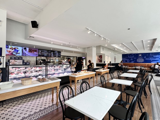 Customers purchase food and drink from Paris Baguette, a new French-Korean bakery that opened in downtown Evanston in mid-June. (Cherie Chueng)