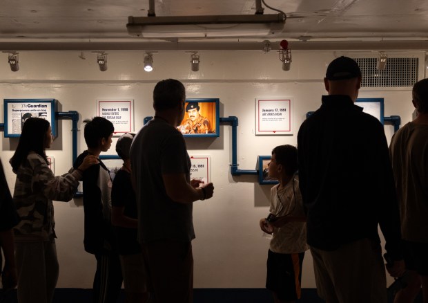 People experience a new exhibit at the USS Midway Museum called "Top Secret: Inside the High-Stakes World of Naval Intelligence" on Friday, June 27, 2025 in San Diego, Calif. (Ana Ramirez / The San Diego Union-Tribune)