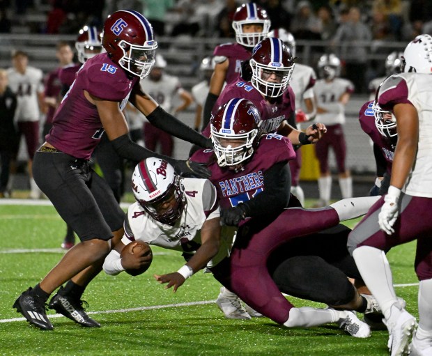 Annapolis' Zach Boyd takes down Broadneck quarterback CJ Watkins on a run in the fourth quarter. The Annapolis Panthers defeated the visiting Broadneck Bruins, 27-26, in high school football Friday evening. (Paul W. Gillespie/Staff)