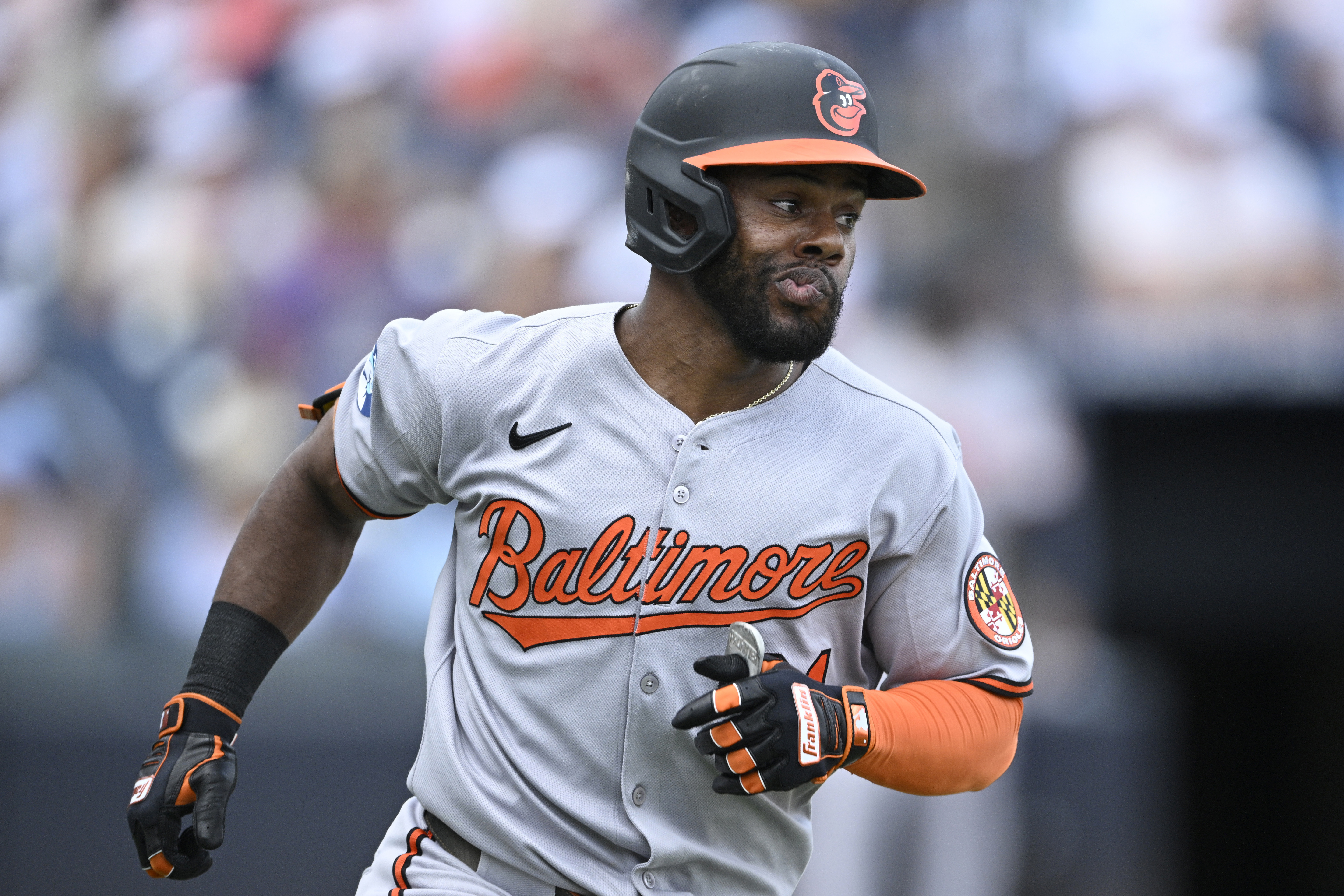 Baltimore Orioles' Cedric Mullins reacts after flying out during the...