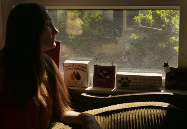 Britney Rothermund, daughter of Christopher Rothermund, looks out the window at her mother and stepfather's home in Craig on July 9, 2025. (Photo by RJ Sangosti/The Denver Post)