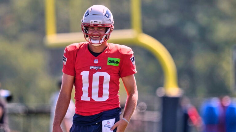 New England Patriots quarterback Drake Maye smiles at the team's NFL football training camp, Wednesday, July 30, 2025, in Foxborough, Mass.