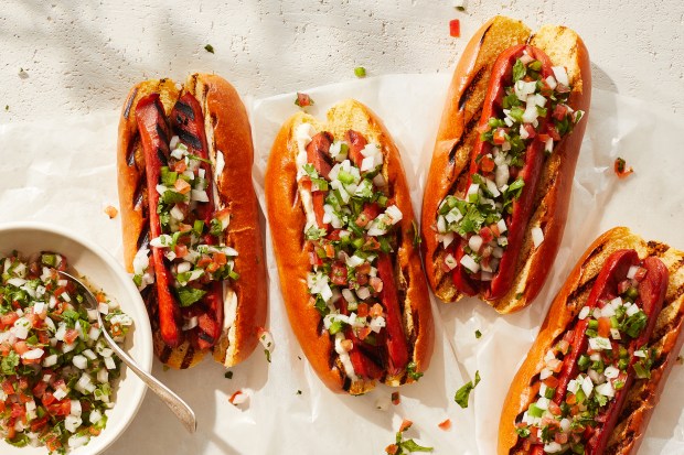 Hot dogs with pico de gallo. Pico de gallo takes things up a notch, as in this recipe from Tanya Sichynsky, and it's such a good way to have a hot dog on a summer night. Props styled by Paige Hicks. Food styled by Simon Andrews. (Christopher Simpson/The New York Times)