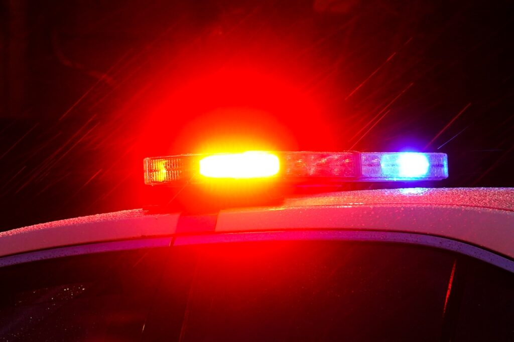 Axe-yielding man arrested after he injured two officers and hid in a shed, police say
