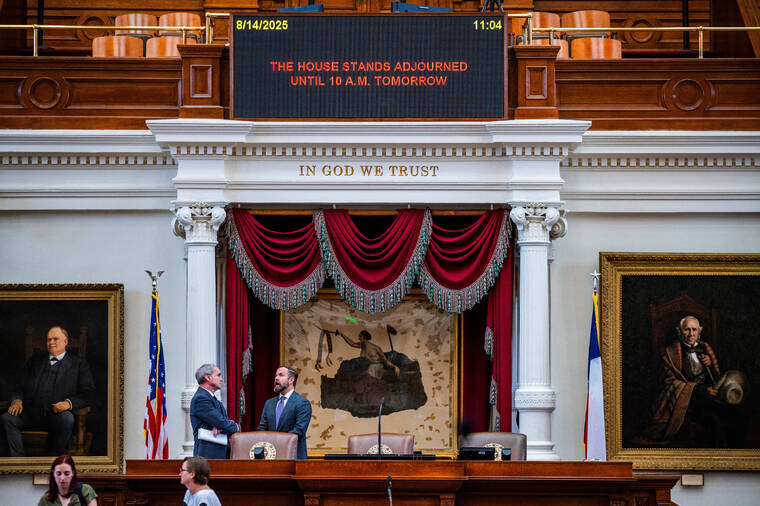 REUTERS/SERGIO FLORES / AUG. 14
                                Rep. Mike Schofield speaks with House Speaker Dustin Burrows on the day of a special session of the Texas House after Democratic lawmakers left the state to deny Republicans the opportunity to redraw the states 38 congressional districts, in Austin, Texas.