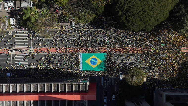 REUTERS/JORGE SILVA
                                A drone view shows supporters of former Brazilian President Jair Bolsonaro taking part in a demonstration against the Supreme Courts measures in his trial, in Sao Paulo, Brazil.
