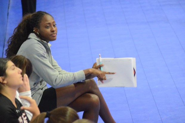 Former Marist star Camryn Hannah, now an assistant coach for the RedHawks, signals a serve during the Crimson Classic at the Great Lakes Volleyball Center in Aurora on Saturday, Aug. 30, 2025. (Jeff Vorva / Daily Southtown)