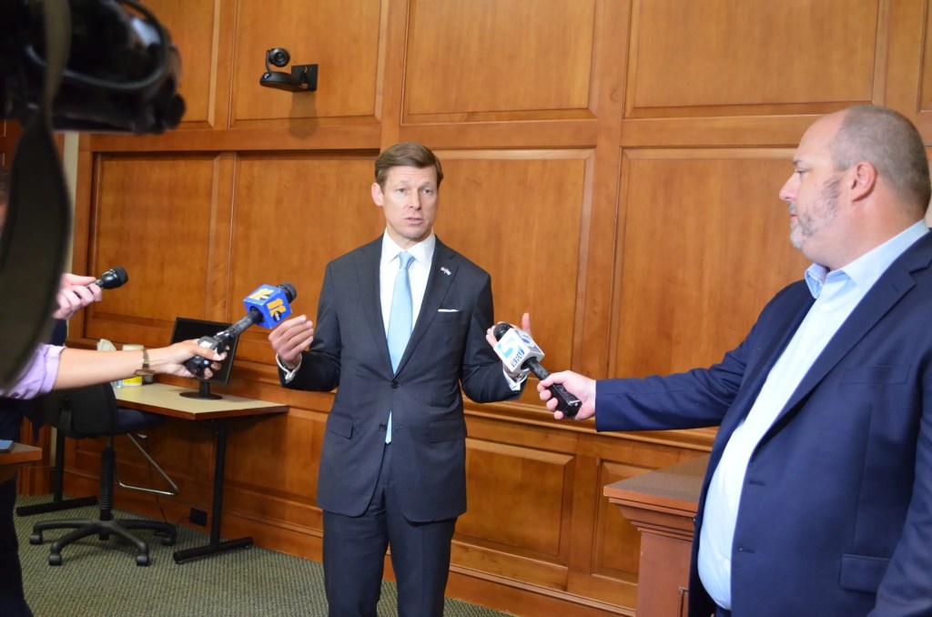Lee Roberts speaks to media at a July meeting of the UNC-CH Board of Trustees.
