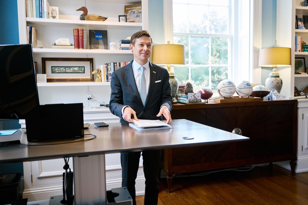 UNC Chancellor Lee Roberts stands at his desk in Chapel Hill, NC.
