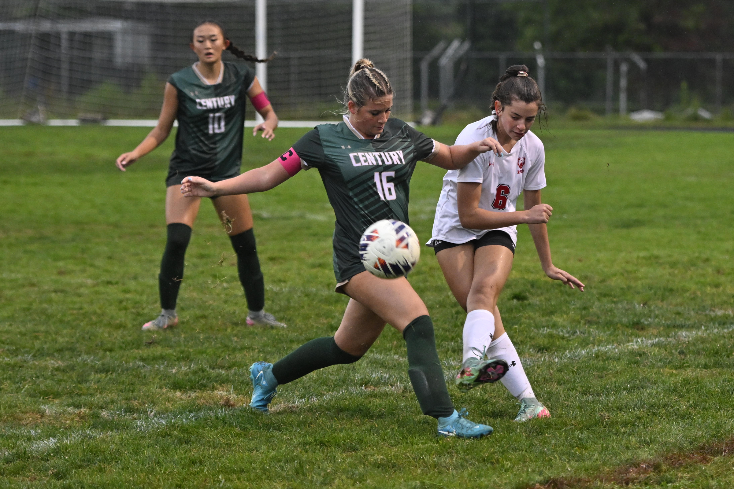 Century's Mia Savage tries to stop Roland Park's Brooklyn Glick...