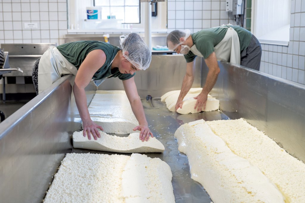 Head cheesemaker Perry Willett (left) and assistant cheesemaker Isaac Brackbill at Shelburne Farms