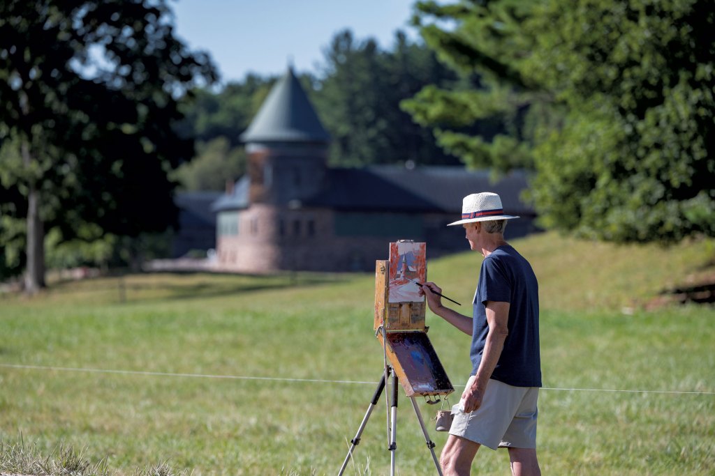 Joe Bolger of Shoreham painting en plein air by the Farm Barn