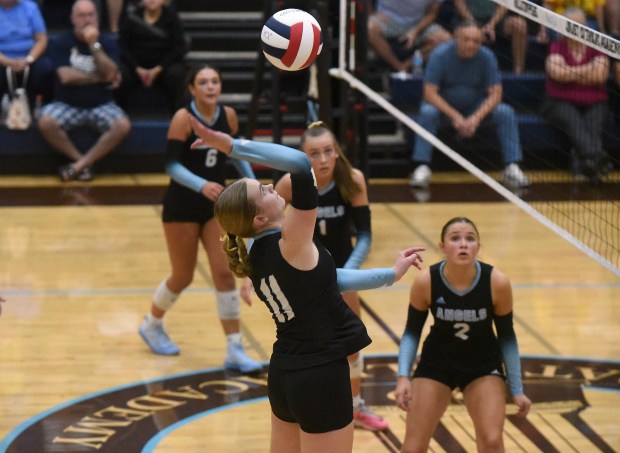 Joliet Catholic's Ella Horn (11) attempts a kill against Providence during a nonconference match Thursday, Sept. 18, 2025 in Joliet, IL. (Steve Johnston/for the Daily Southtown)